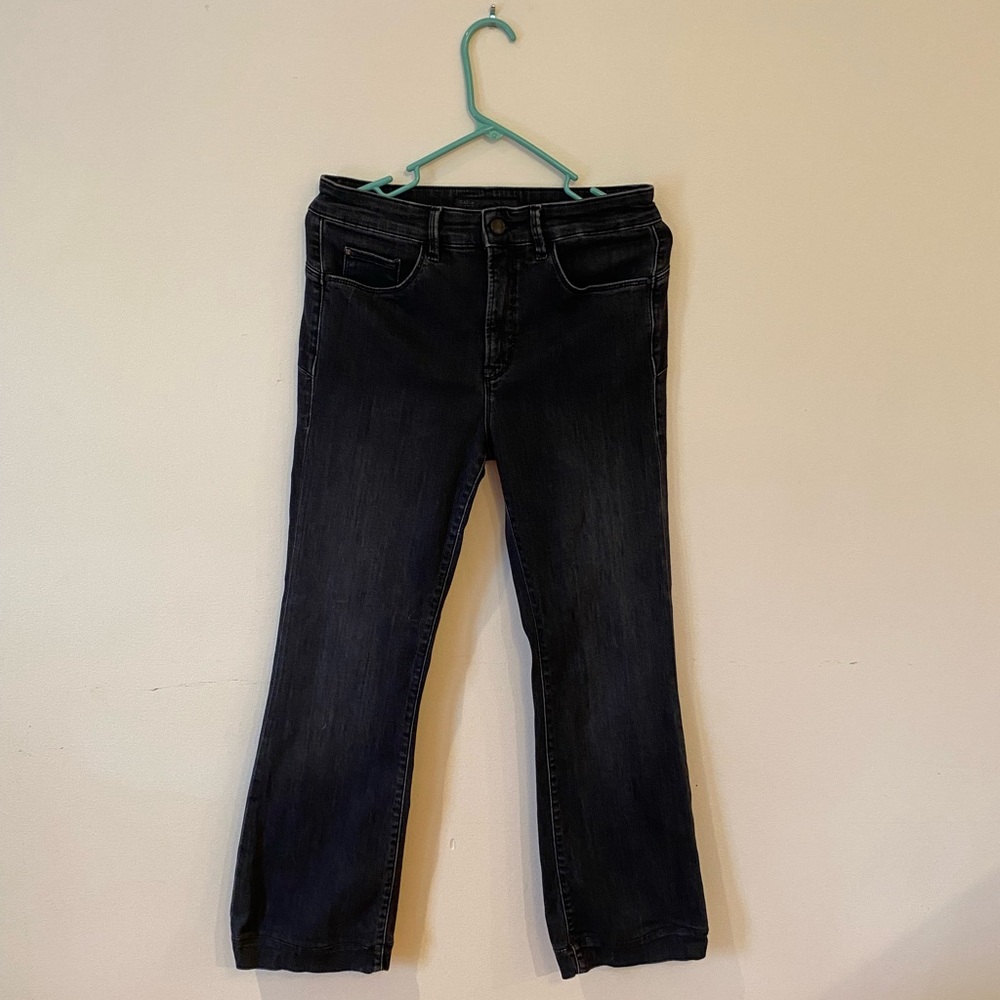 Mid rise black denim jeans, fitted and flare/bootcut